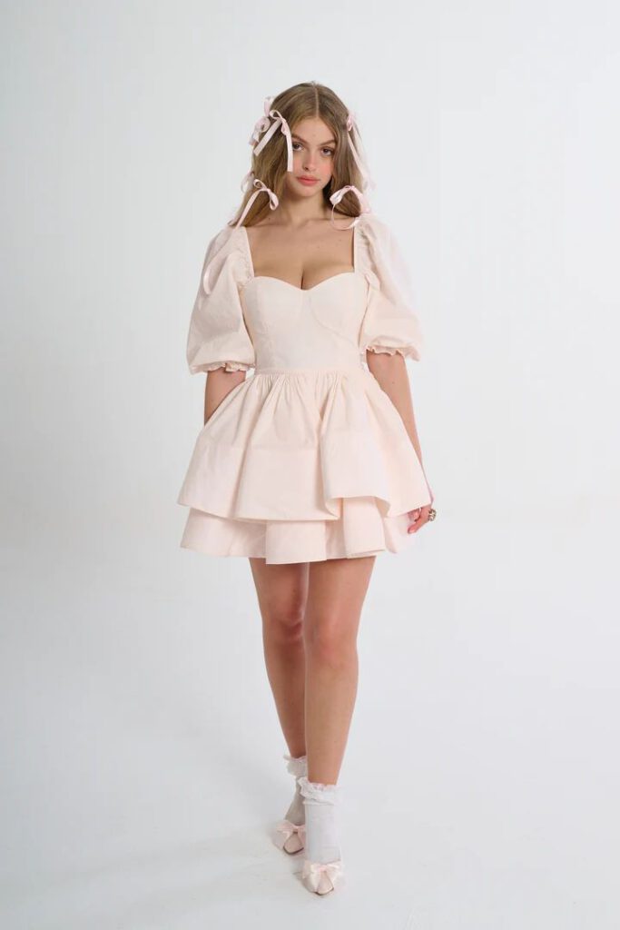Coquette aesthetic outfit with pink bow and corset blouse — coquette aesthetic trend