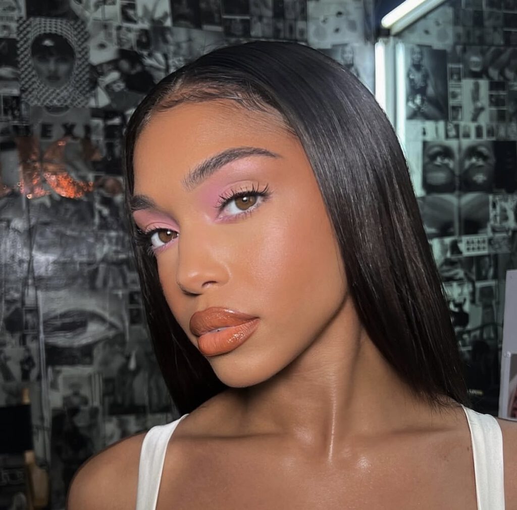 Soft glam pastel makeup look with bronzed skin and pink eyeshadow