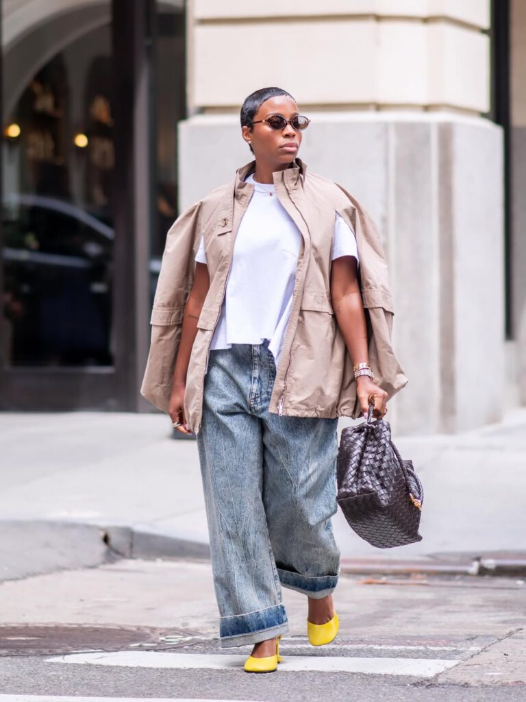 woman wearing a lightweight nude jacket in spring with jeans