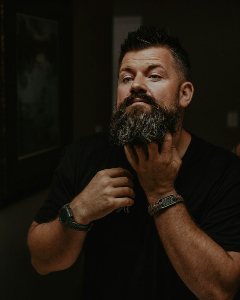 Well-groomed man in fitted clothing representing habits of men who always look put together
