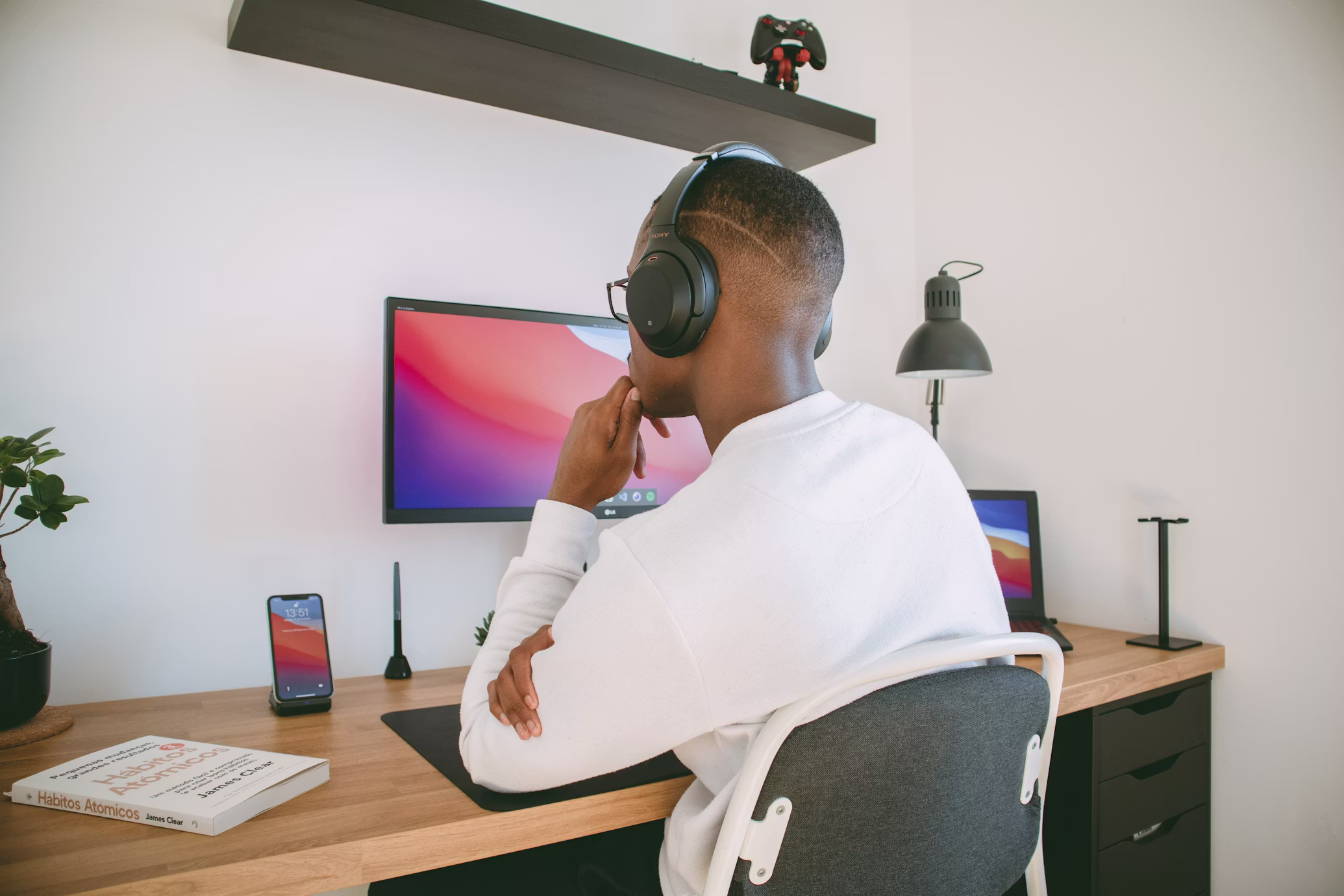Man working calmly from home workspace representing intentional living and deliberate productivity