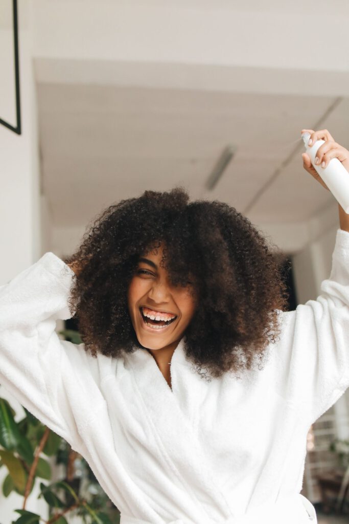 woman hydrating hair summer tips